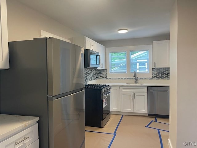 530 Lenox Ave, Oneida, NY 13421 - kitchen featuring appliances with stainless steel finishes, decorative backsplash, and light countertops