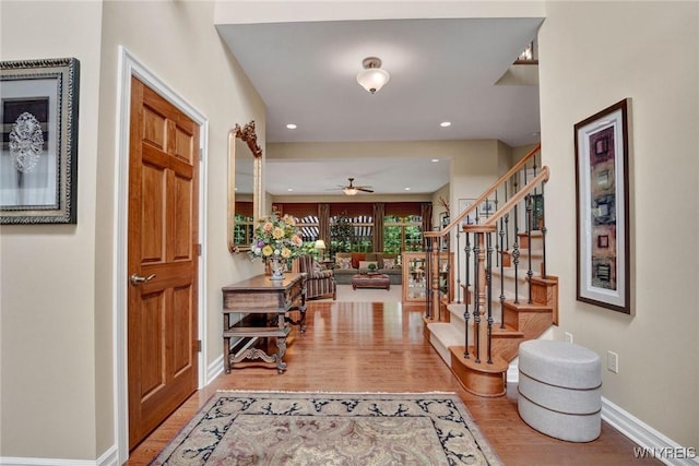 81 Hidden Oaks Ct, Grand Island, NY 14072 - foyer featuring wood finished floors, a ceiling fan, stairs, recessed lighting, and baseboards