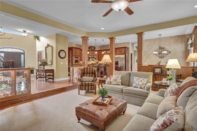 81 Hidden Oaks Ct, Grand Island, NY 14072 - living area featuring decorative columns, a ceiling fan, light carpet, recessed lighting, and baseboards