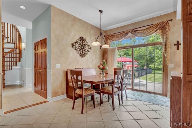 81 Hidden Oaks Ct, Grand Island, NY 14072 - dining space with stairway, baseboards, and light tile patterned floors