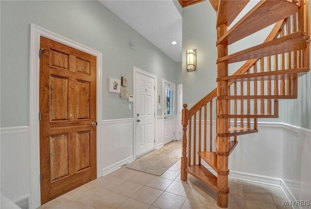 81 Hidden Oaks Ct, Grand Island, NY 14072 - tiled entryway with stairway, a wainscoted wall, and recessed lighting