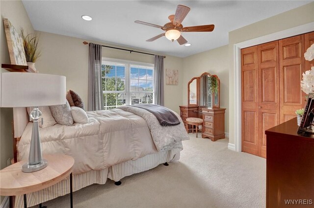 81 Hidden Oaks Ct, Grand Island, NY 14072 - bedroom featuring light colored carpet, recessed lighting, ceiling fan, baseboards, and a closet