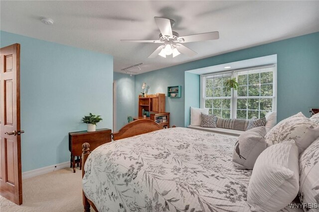 81 Hidden Oaks Ct, Grand Island, NY 14072 - bedroom with carpet floors, baseboards, attic access, and a ceiling fan