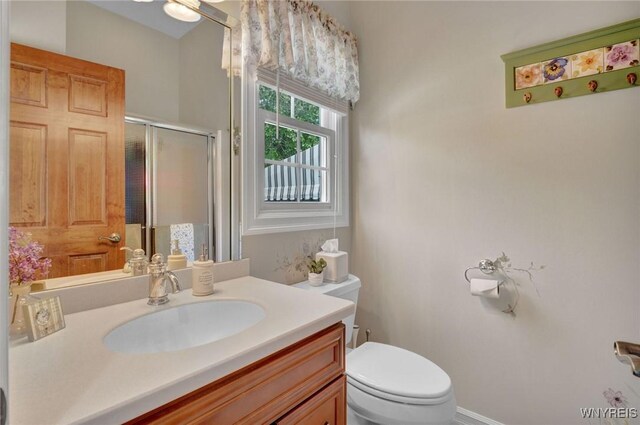 81 Hidden Oaks Ct, Grand Island, NY 14072 - bathroom with toilet, vanity, and a shower stall