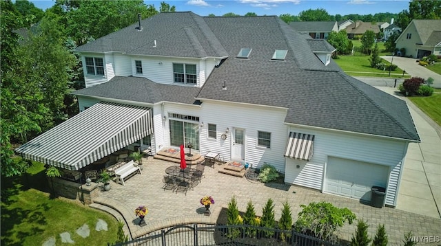 81 Hidden Oaks Ct, Grand Island, NY 14072 - back of house featuring entry steps, a shingled roof, and a patio