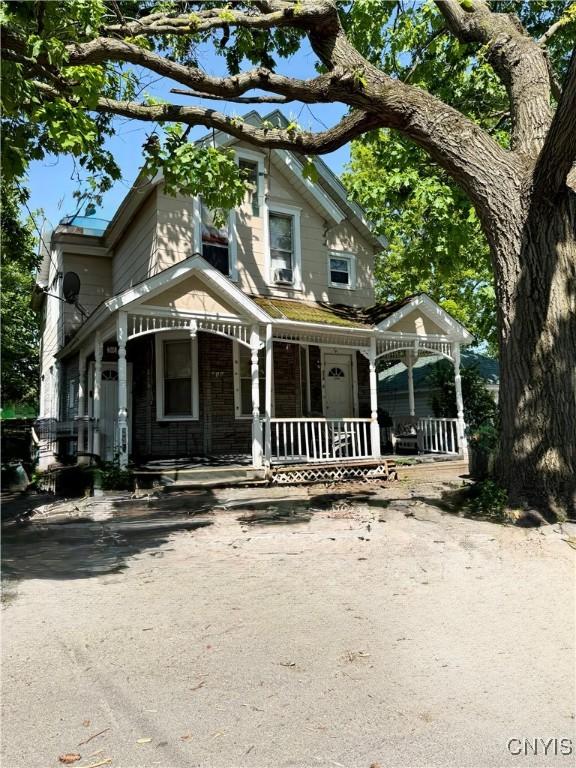 214-16 Reed Ave, Syracuse, NY 13207 - victorian house featuring covered porch