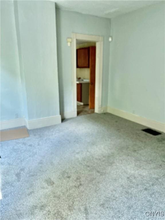 214-16 Reed Ave, Syracuse, NY 13207 - unfurnished room with carpet flooring and baseboards