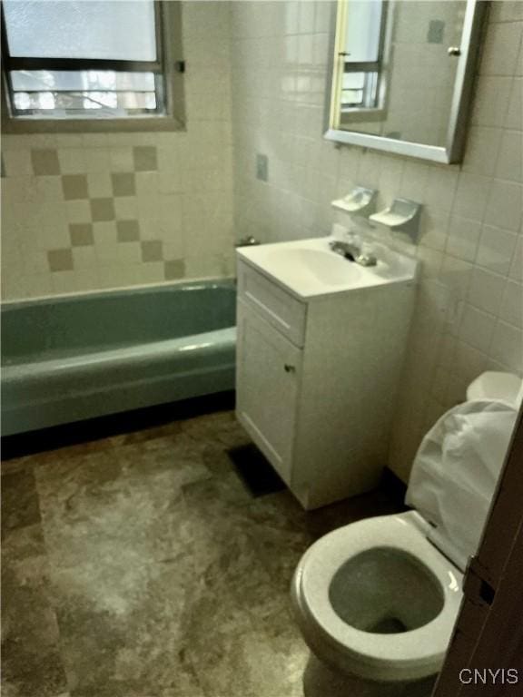 214-16 Reed Ave, Syracuse, NY 13207 - full bathroom with tile walls, vanity, and shower / bathtub combination