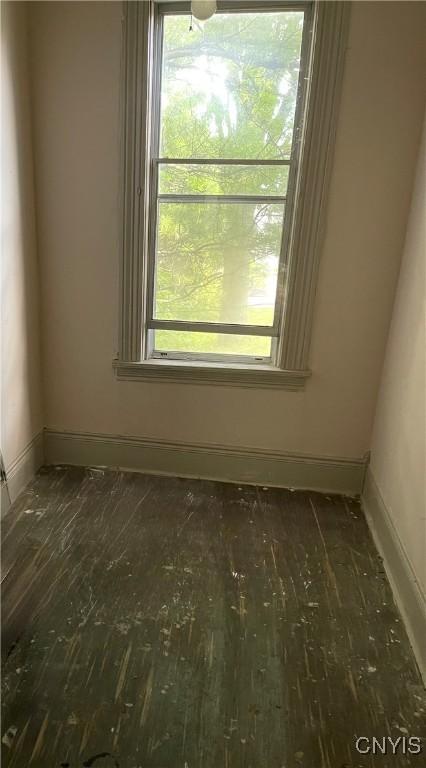 214-16 Reed Ave, Syracuse, NY 13207 - empty room with hardwood / wood-style floors and healthy amount of natural light