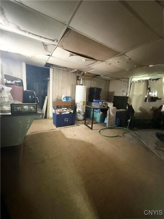 214-16 Reed Ave, Syracuse, NY 13207 - unfinished below grade area featuring water heater and a paneled ceiling