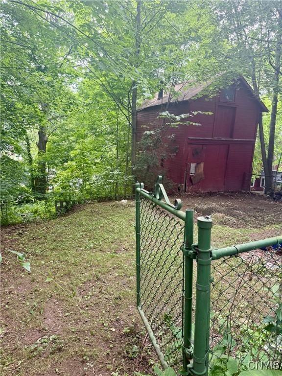214-16 Reed Ave, Syracuse, NY 13207 - view of yard featuring an outdoor structure, a barn, and a gate