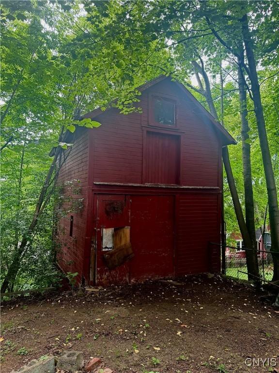 214-16 Reed Ave, Syracuse, NY 13207 - view of side of property featuring a barn and an outbuilding