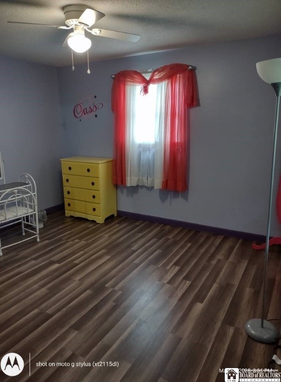 613 N Main St, Pine Grove Township, PA 16345 - bedroom with dark wood finished floors, a ceiling fan, and a textured ceiling