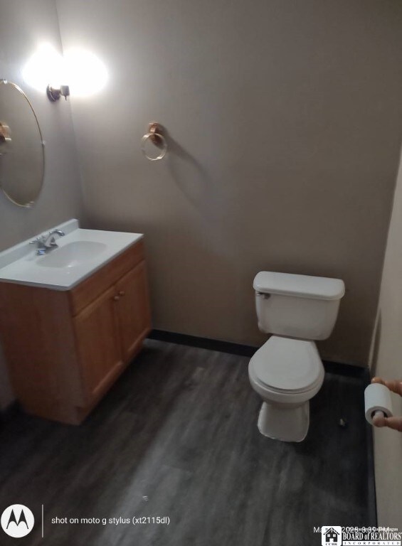 613 N Main St, Pine Grove Township, PA 16345 - bathroom featuring vanity and wood finished floors