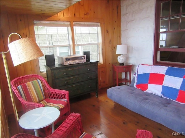 250 Pine Grove Rd Unit 3, Richland, NY 13142 - sitting room with wood walls, hardwood / wood-style flooring, and vaulted ceiling