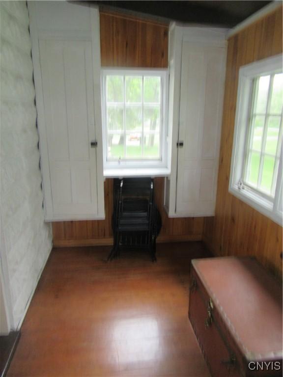 250 Pine Grove Rd Unit 3, Richland, NY 13142 - empty room with wood walls and wood finished floors