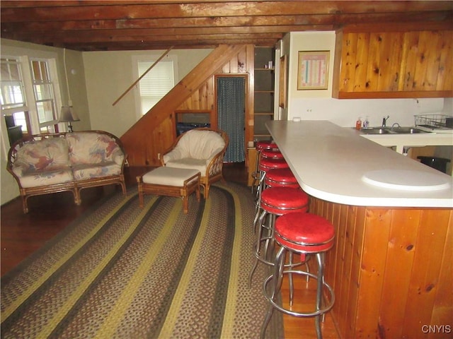250 Pine Grove Rd Unit 3, Richland, NY 13142 - kitchen with wood finished floors, a sink, and a breakfast bar area