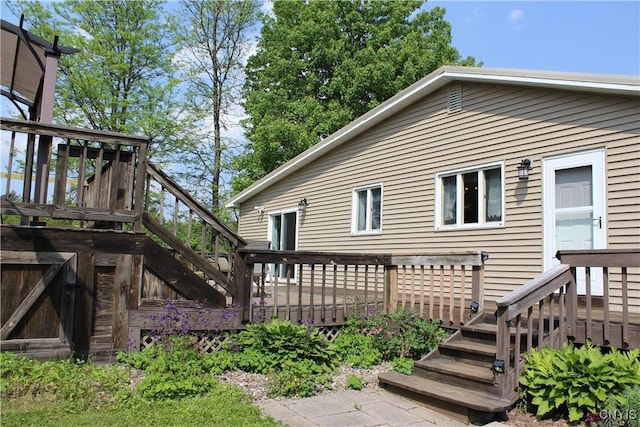 236 Harry Bryant Rd, Amboy, NY 13493 - rear view of house with stairs and a wooden deck