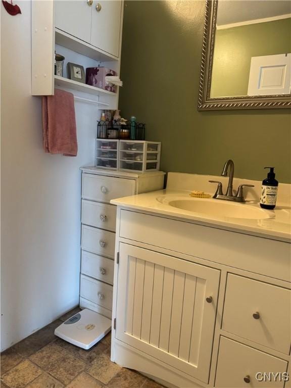 236 Harry Bryant Rd, Amboy, NY 13493 - bathroom with vanity, stone finish floors, and ornamental molding