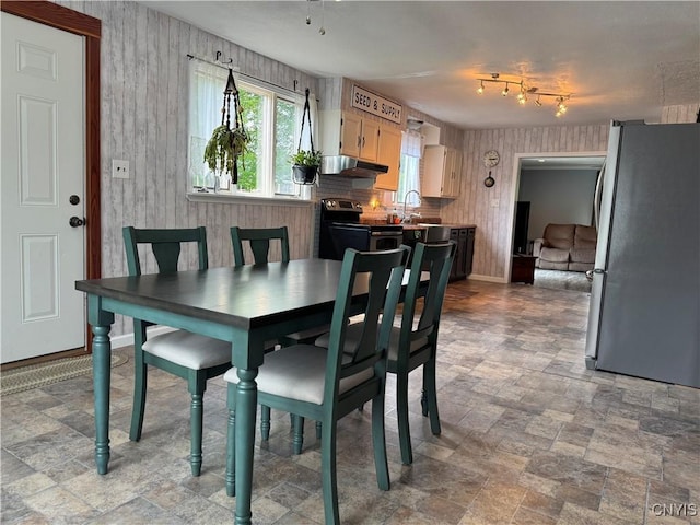 236 Harry Bryant Rd, Amboy, NY 13493 - dining area featuring wallpapered walls and stone finish flooring