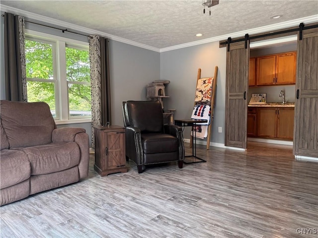 236 Harry Bryant Rd, Amboy, NY 13493 - living room featuring a barn door, crown molding, wood finished floors, recessed lighting, and a textured ceiling