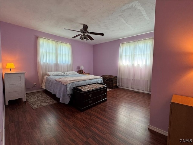 236 Harry Bryant Rd, Amboy, NY 13493 - bedroom featuring dark wood-style flooring, baseboards, a ceiling fan, and a textured ceiling