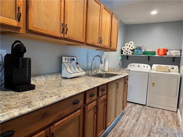 236 Harry Bryant Rd, Amboy, NY 13493 - laundry room featuring washing machine and dryer, light wood-style flooring, cabinet space, and recessed lighting