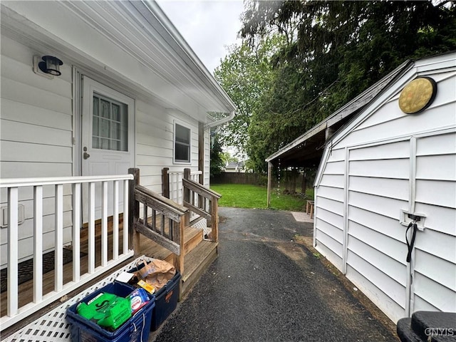 104 Lansdale Rd, Dewitt, NY 13057 - wooden terrace featuring asphalt driveway