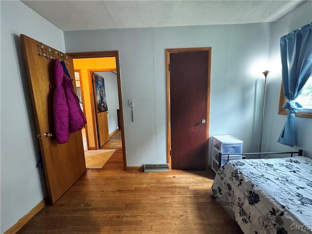 104 Lansdale Rd, Dewitt, NY 13057 - bedroom with wood finished floors and baseboards