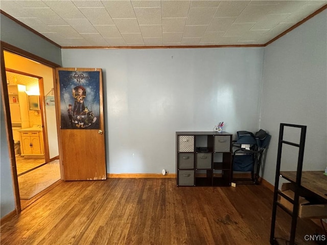 104 Lansdale Rd, Dewitt, NY 13057 - unfurnished bedroom with ornamental molding, wood finished floors, baseboards, and an office area