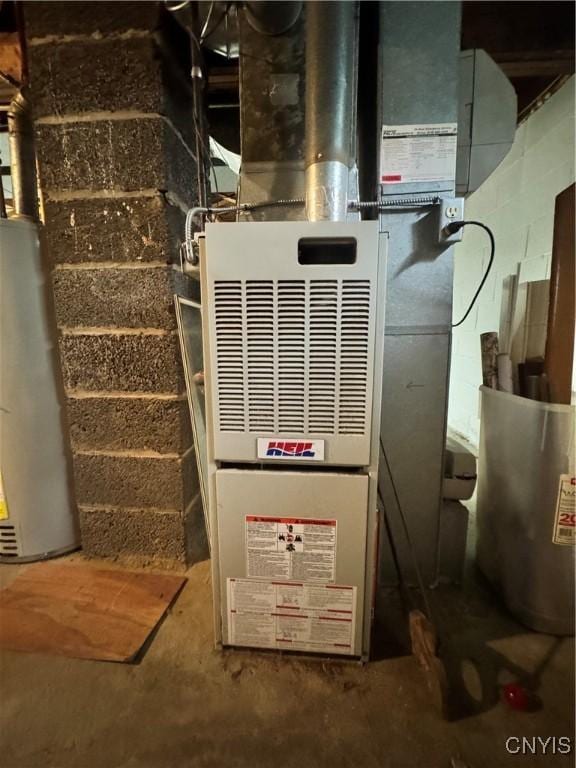 104 Lansdale Rd, Dewitt, NY 13057 - utility room with gas water heater and heating unit