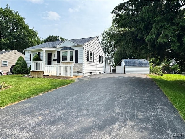 104 Lansdale Rd, Dewitt, NY 13057 - view of front of house with a front lawn, a porch, and an outdoor structure