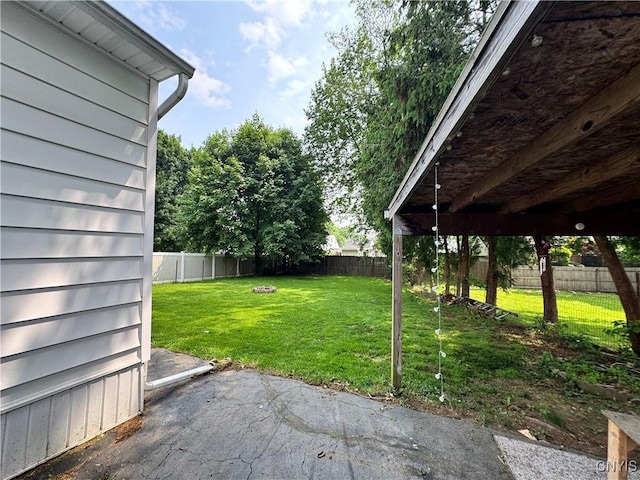 104 Lansdale Rd, Dewitt, NY 13057 - fenced backyard with a patio
