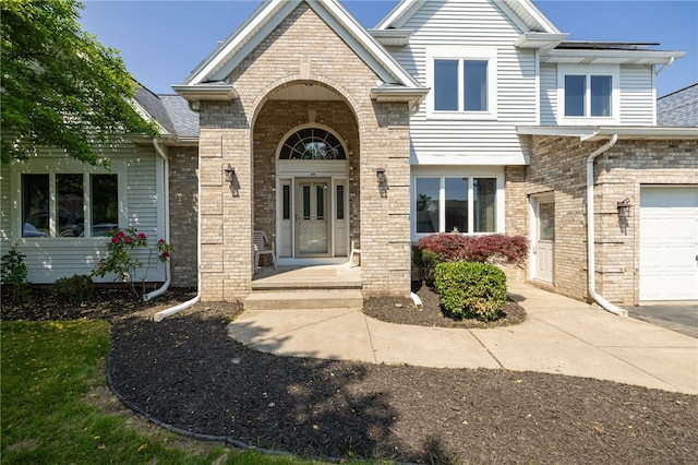 204 Red Hickory Dr, Greece, NY 14626 - property entrance featuring brick siding and a garage