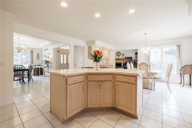 204 Red Hickory Dr, Greece, NY 14626 - kitchen with a chandelier, a center island, recessed lighting, light countertops, and light tile patterned floors