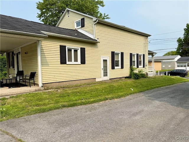 306 Seymour St, Auburn, NY 13021 - view of side of property featuring a lawn