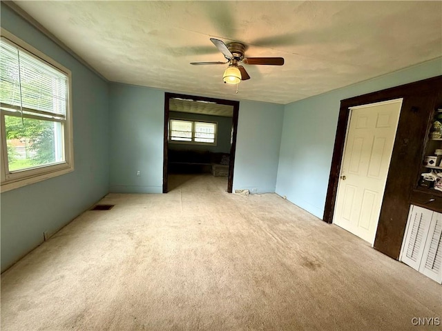 306 Seymour St, Auburn, NY 13021 - carpeted spare room featuring a ceiling fan