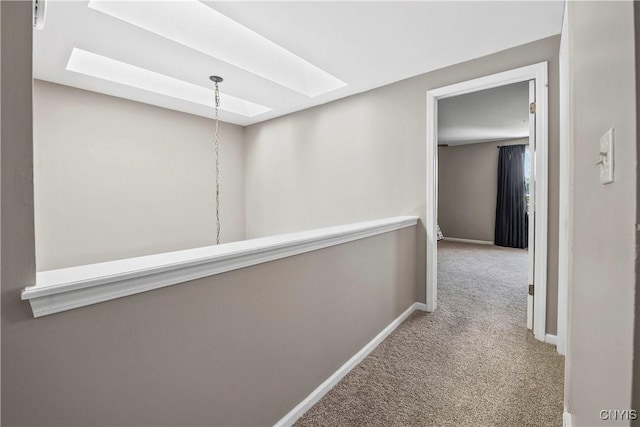 6121 Diffin Rd, Cicero, NY 13039 - hallway with a skylight, carpet flooring, and baseboards