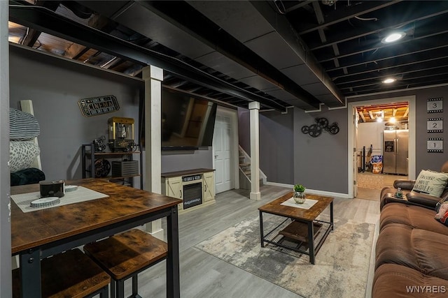 157 73rd St, Niagara Falls, NY 14304 - finished basement with stainless steel fridge with ice dispenser, stairs, light wood-type flooring, and baseboards
