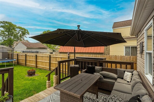 157 73rd St, Niagara Falls, NY 14304 - deck featuring an outdoor living space with a fire pit and a trampoline