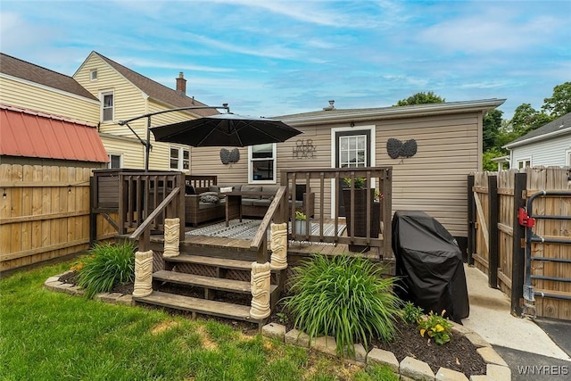157 73rd St, Niagara Falls, NY 14304 - back of house featuring a wooden deck, an outdoor living space, and a fenced backyard