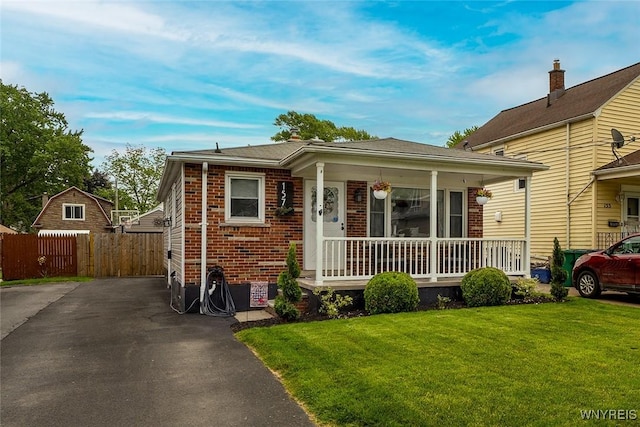 157 73rd St, Niagara Falls, NY 14304 - view of front of house with a porch and brick siding