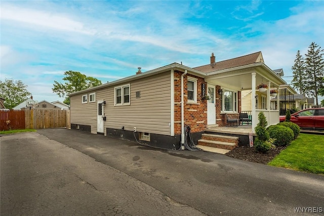 157 73rd St, Niagara Falls, NY 14304 - view of property exterior with covered porch and brick siding