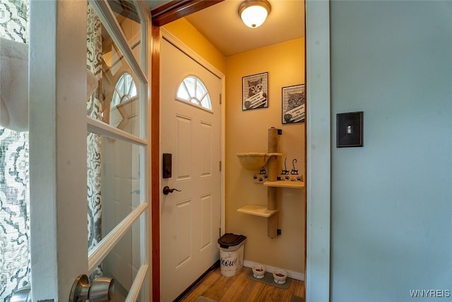 157 73rd St, Niagara Falls, NY 14304 - foyer featuring wood finished floors and baseboards