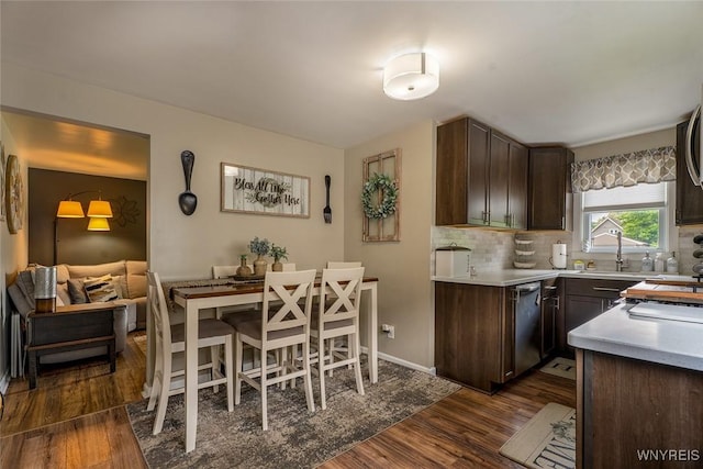 157 73rd St, Niagara Falls, NY 14304 - kitchen with stainless steel dishwasher, dark brown cabinetry, dark wood finished floors, and a sink
