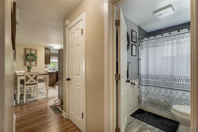157 73rd St, Niagara Falls, NY 14304 - full bathroom featuring wood finished floors, toilet, and a shower with curtain
