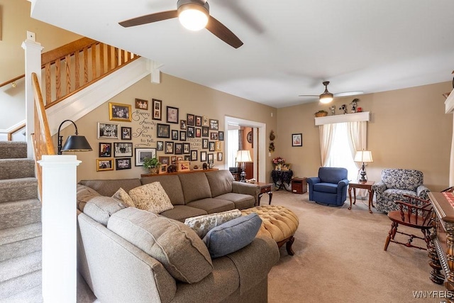 57 Savage Pl, Aurora, NY 14052 - living room featuring a ceiling fan, light colored carpet, and stairs