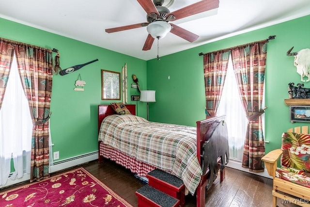 57 Savage Pl, Aurora, NY 14052 - bedroom featuring a baseboard radiator, hardwood / wood-style flooring, and a ceiling fan