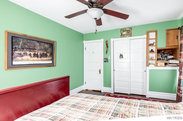 57 Savage Pl, Aurora, NY 14052 - bedroom with baseboards, a closet, wood finished floors, and a ceiling fan