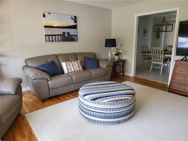 76 Belaire Dr, Big Flats, NY 14845 - living area with wood finished floors and baseboards